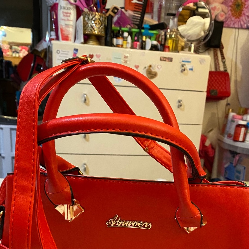 Red handbag.